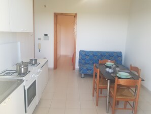 Apartment, 1 Bedroom (Bilocale Europa 90) | Living area | Flat-screen TV - Bilocali Baia Verde (Gallipoli)