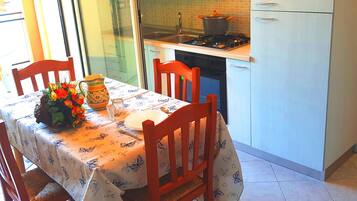 Apartment, 1 Bedroom (Bilocali Savonarola) | Private kitchenette | Full-size fridge, oven, stovetop, cookware/dishes/utensils