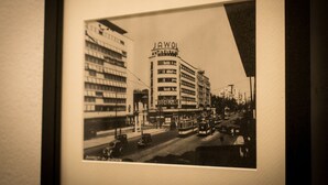 A black and white photograph of a city street with a building labeled "JAWOL" prominently displayed. - ❤️ CityCenter Athenaeum Exquisite 1BD Apartment ❤️ (Sector 1)