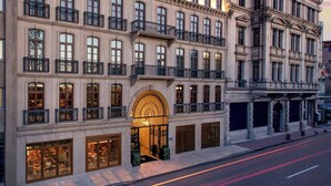 A JW Marriott hotel with multiple floors, large windows, and a prominent entrance with a curved archway. - JW Marriott Istanbul Bosphorus (Istanbul)