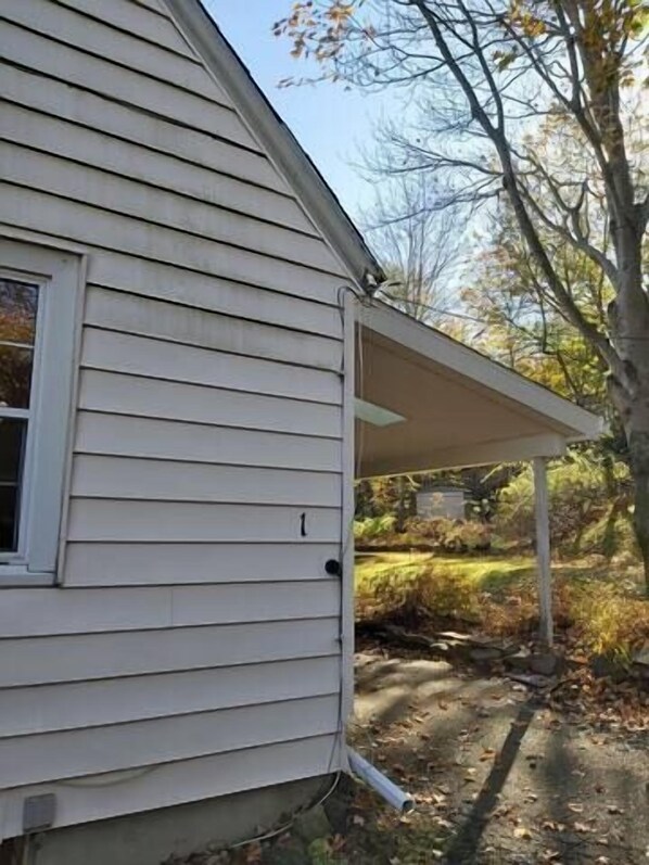 A house with a covered porch, a window, and a number '1' on the wall. - 1930'S Charming & Enchanted Unit By Waterfalls (Armdale)