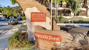 A sign indicating the birthplace of California and a welcome sign to Old Town.