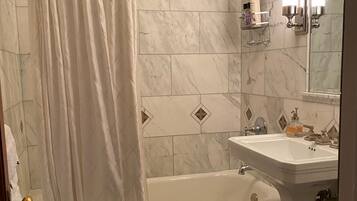 Combined shower/tub, hair dryer, towels, soap