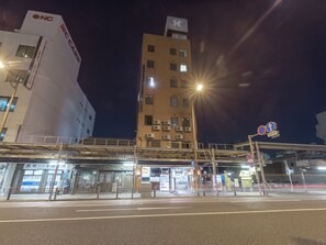 A multi-story building with signage for "ONC" and "IC CARD" on the left. - Tabist Business Hotel Kanazono Gifu (Gifu)