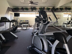 Fitness facility - This townhouse is located in Adult gated 55+community = Apache Wells II .Desirable location on greenbelt w/N/S orientation.Heated pool & spa Great Club House and Fitness Center , Library TV room, Bilard roomCatering Kitchen serving coffee every morning... (Mesa)