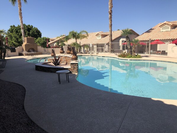 Outdoor pool, a heated pool - This townhouse is located in Adult gated 55+community = Apache Wells II .Desirable location on greenbelt w/N/S orientation.Heated pool & spa Great Club House and Fitness Center , Library TV room, Bilard roomCatering Kitchen serving coffee every morning... (Mesa)