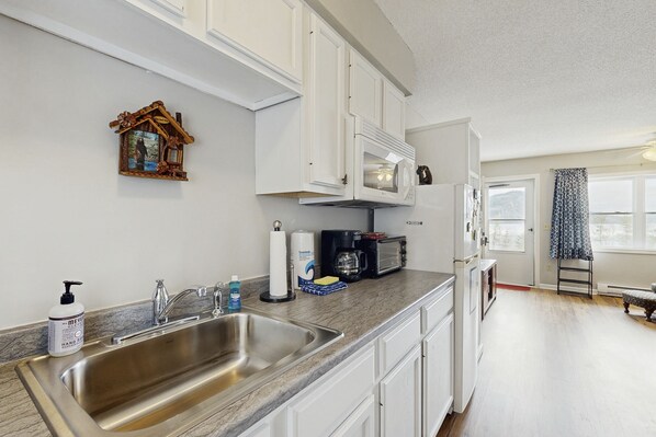 Fridge, microwave, coffee/tea maker, toaster