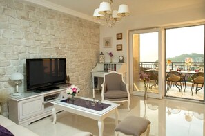 TV, fireplace, books