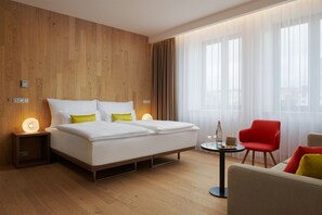 Family Room | Minibar, in-room safe, desk, laptop workspace - Hotel Passage (Brno)