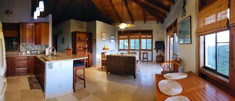 Enjoy a spacious open-plan layout with a kitchen, dining area, and living room, perfect for relaxing and socializing.