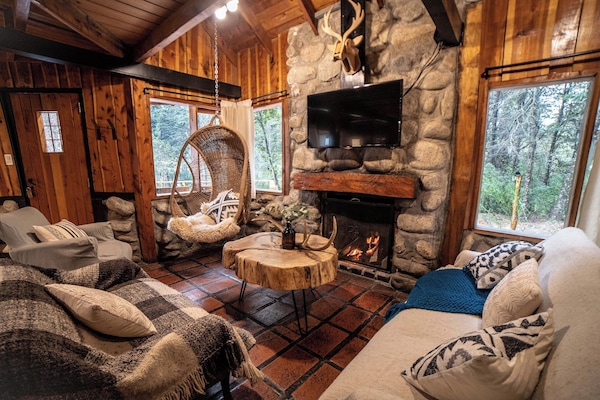 Family Cabin (CABAÑA LA RUMA) | Living area | 32-inch LCD TV with satellite channels, TV, fireplace