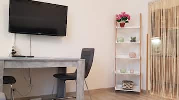49-inch flat-screen TV with cable channels, TV