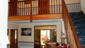 A wooden staircase with a railing leading to an upper floor. - Birchdale House B&B (Greenan)