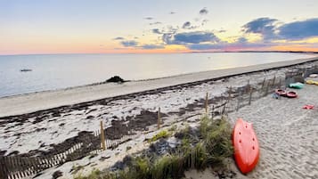 Enjoy a beachside escape with ocean views, a wooden fence, and beach toys at your doorstep.
