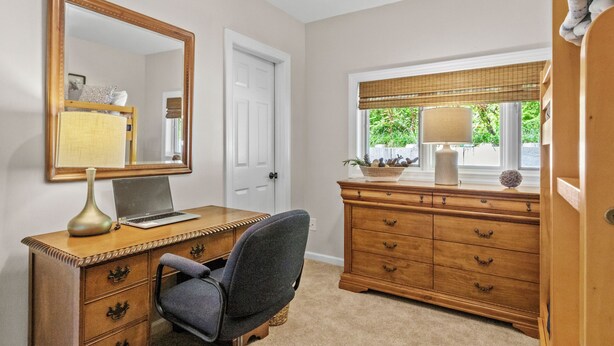 A room with a desk, chair, dresser, mirror, and window with blinds. - Walk to Ski Lodge..Mountain Views..Includes Ski Lodge Locker (Sugar Mountain)