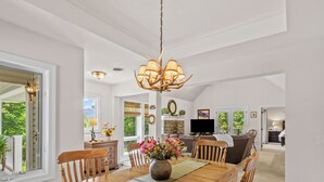 A spacious dining area with a wooden table, chairs, and a chandelier. - Walk to Ski Lodge..Mountain Views..Includes Ski Lodge Locker (Sugar Mountain)