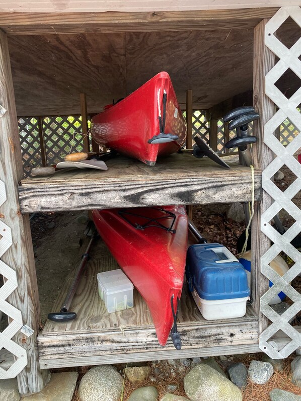 A wooden structure with a red object on the top shelf and a blue container on the bottom shelf. - Every window has a spectacular lake view
Low fees (Wayne)