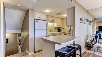 Condo | Private kitchen | Stovetop, dishwasher, cookware/dishes/utensils