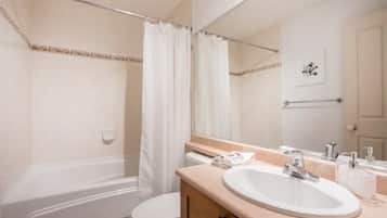 Combined shower/bathtub, hair dryer, towels, soap