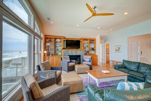 Télévision, cheminée, lecteur de DVD, baby-foot