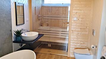 Bathtub, hair dryer, bidet, towels
