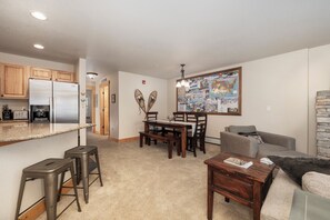 Smart TV, fireplace, books, computer monitors