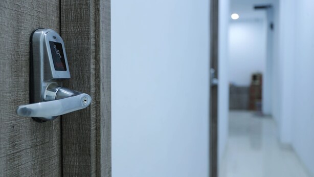 A door with a modern electronic lock and a keyhole. - Ratana Cengkareng (Jakarta)