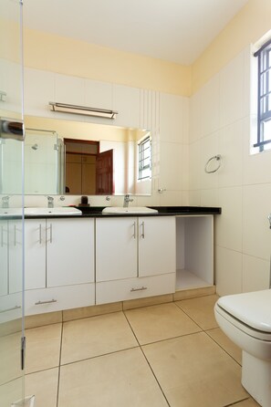 Bathtub, towels, soap, toilet paper