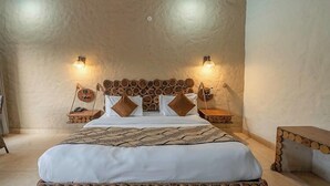 A bedroom with a wooden headboard, two bedside tables, a bed with white bedding, and wall-mounted lights. - Delight Stay Resort Dhikuli - Corbett (Ramnagar)