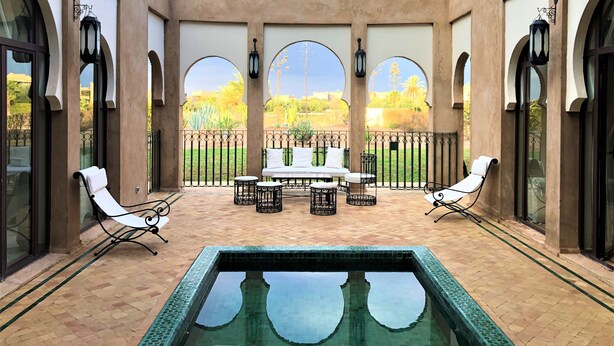 A covered outdoor area with a pool, seating, and a view of the landscape. - Villa Mayrit. Beautiful Riyadh style villa in privileged surroundings (Marrakech)