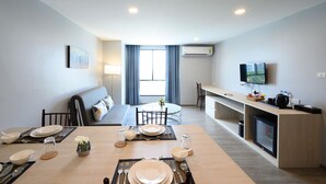 Junior Double Room | Living area | 24-inch flat-screen TV with cable channels, TV - IWISH Hotel (Nonthaburi)