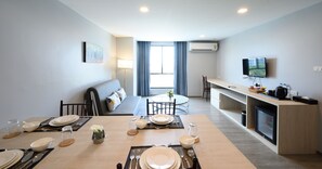 Junior Double Room | Living area | 24-inch flat-screen TV with cable channels, TV - IWISH Hotel (Nonthaburi)