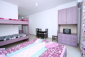 Apartment, Sea View, Beachfront | Living area | TV