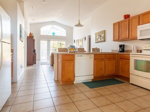 Full-sized fridge, microwave, oven, stovetop - 4 Bed and 3 Bath in Perfect Location with pool by Florida Dream Home (Kissimmee)