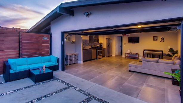 A modern house with an open-plan living area, kitchen, and dining space.