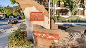 A sign indicating the birthplace of California and a welcome sign to Old Town.