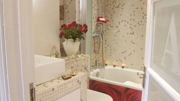 Combined shower/tub, hair dryer, towels, soap