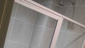 Separate tub and shower, rainfall showerhead, free toiletries