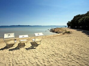 On the beach, sun-loungers, beach towels