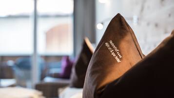 A close-up of a pillow with text indicating it is from a hotel.
