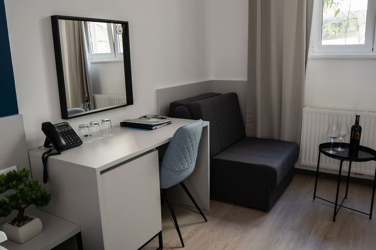 Standard Triple Room, Annex Building | Minibar, in-room safe, desk, laptop workspace