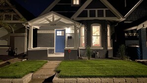 A two-story house with a blue door and a number 3329 on the front wall. - Victorian Home in Denver's Hip Highlands Square (Denver)