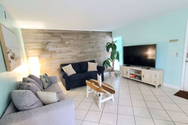 Living Room with 65 inch TV with ROKU+