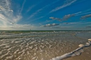 A beach with waves, clear sky, and a distant horizon. - Steps 2 beach! Beachy and Luxurious! Easy Living! (Clearwater Beach)
