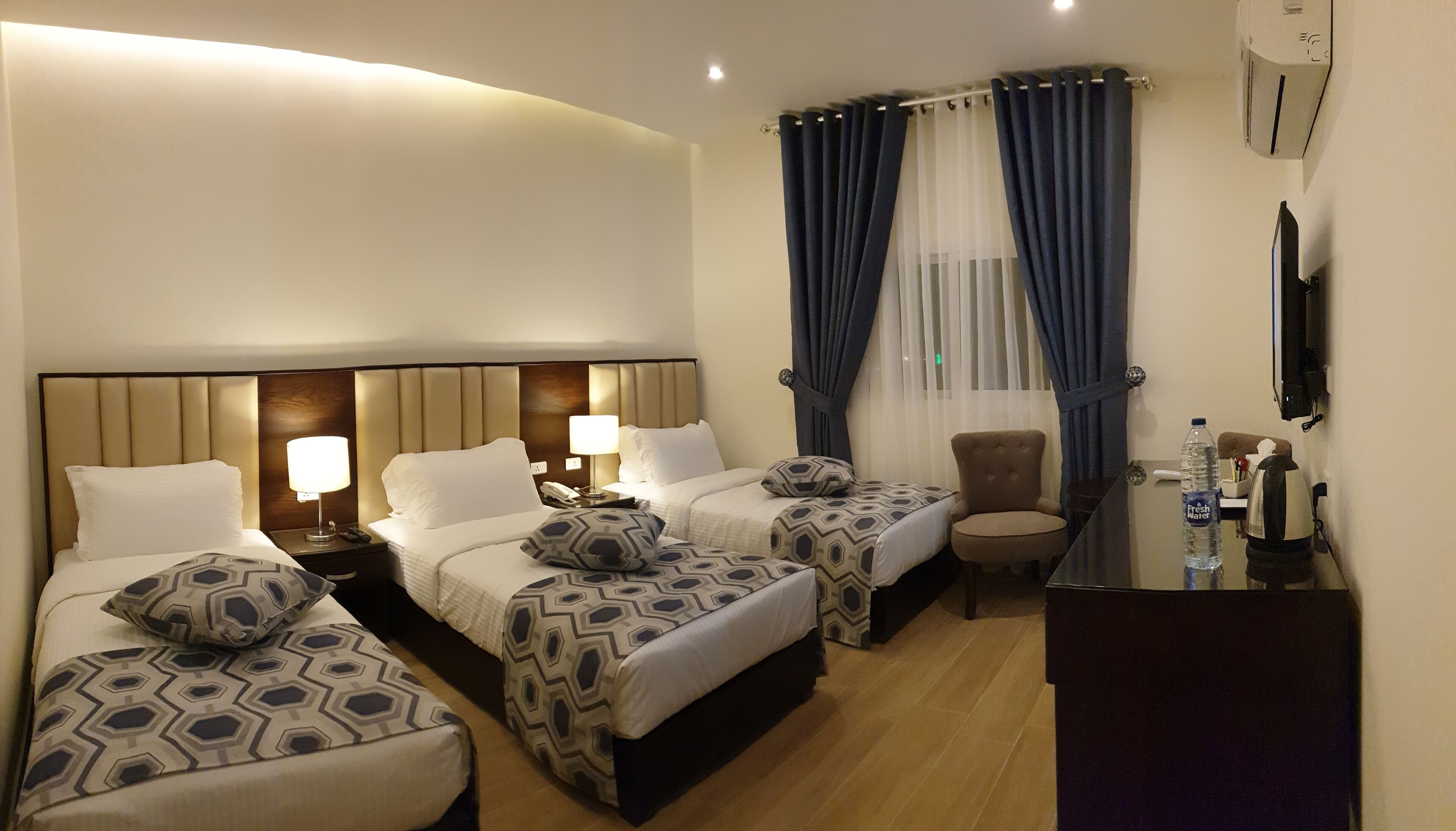 deluxe triple room | 1 bedroom, pillow-top beds, minibar, in-room safe