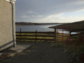 Surrounded by rolling hills and a serene lake view, this peaceful retreat offers a secluded escape.