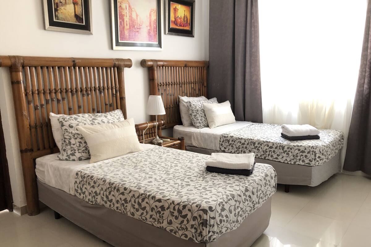 Deluxe Penthouse, 3 Bedrooms, Pool View, Beachfront | In-room safe, desk, laptop workspace, iron/ironing board