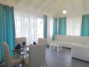 Premium Suite, 2 Bedrooms, Ocean View, Beachfront | Living room | Flat-screen TV - TrueCost Resort Villas Paradise (Punta Cana)