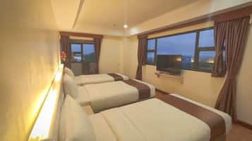 Deluxe Triple Room, City View | In-room safe, desk, laptop workspace, blackout curtains
