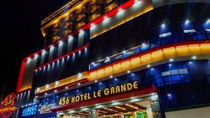 A hotel with a prominent sign reading "456 HOTEL LE GRANDE" and a neon sign for "45B". - 456 Hotel (Baguio)